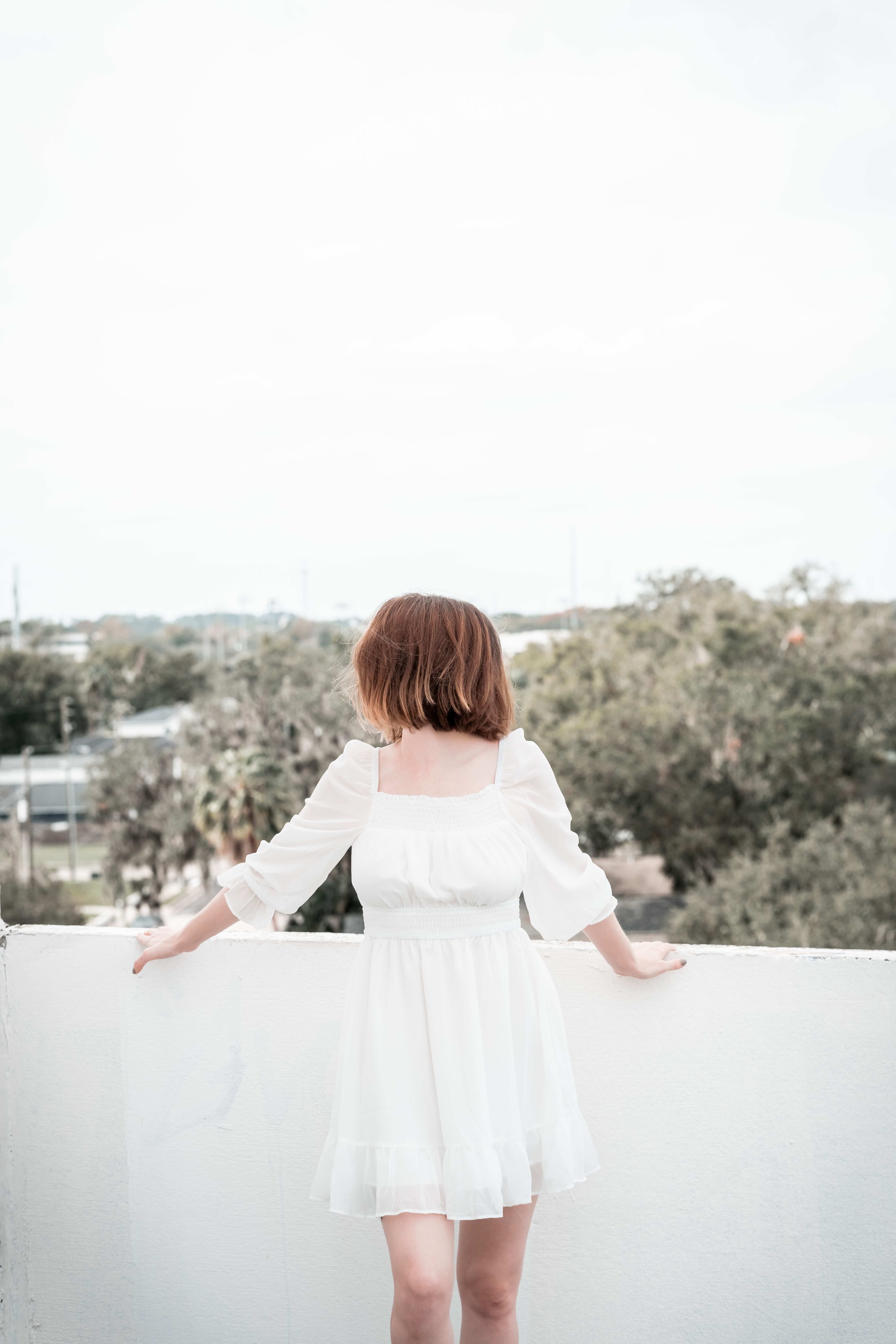 A Woman in White Long Sleeve Dress · Free Stock Photo