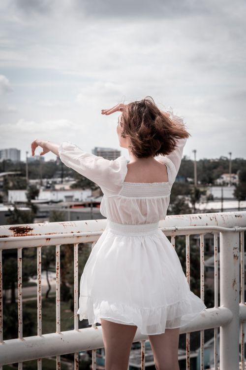 A Lady in White Long Sleeve Dress  Free Stock Photo