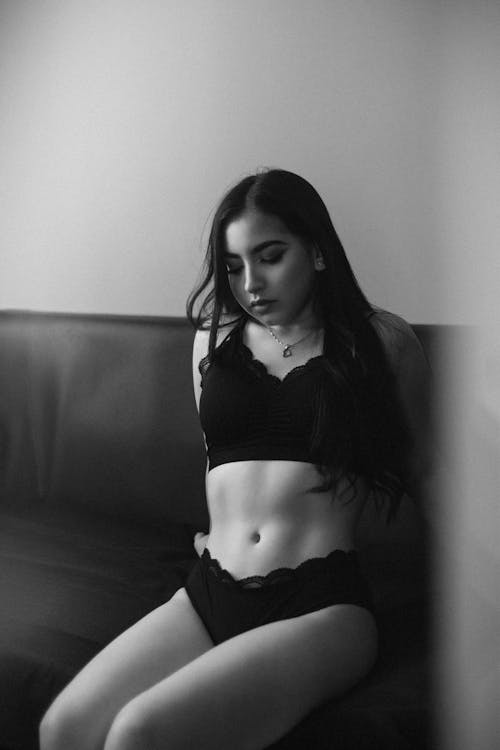Black and White Photo of a Girl in Black Lingerie