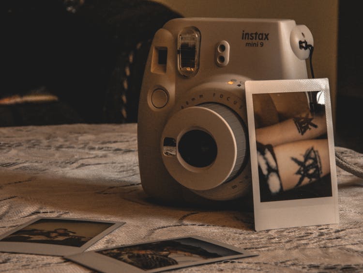 Polaroid Camera And Photos 