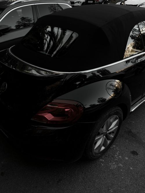 Free Black convertible parked outdoors, showcasing modern automotive design. Stock Photo