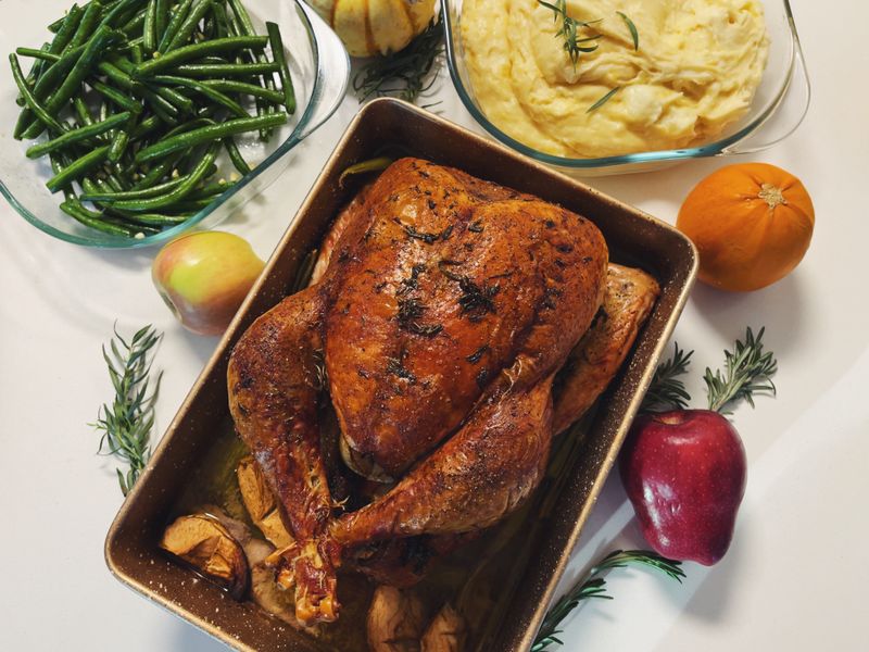 Thanksgiving dinner with turkey, mashed potatoes, and green beans