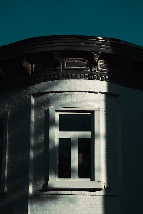 Shadow on Old Classic Brick House Facade with Window