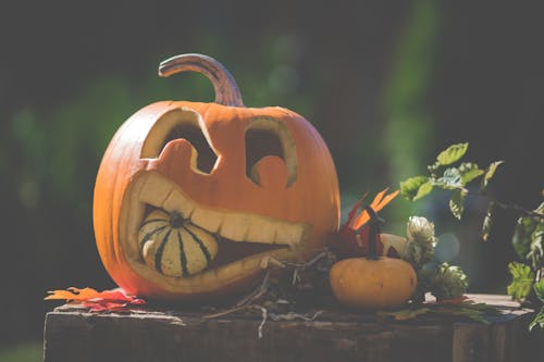 Jack O' Lantern On Top Of Wooden Surface