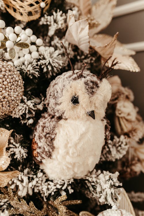 White Teddy Bear on Brown Leaves