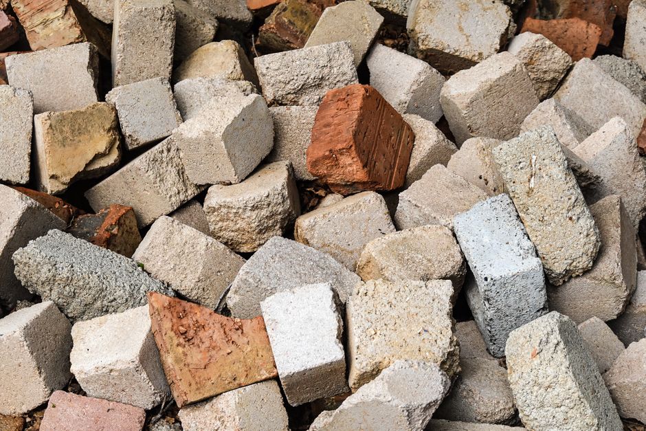 Hardscape materials like concrete and bricks - hardscapes landscaping