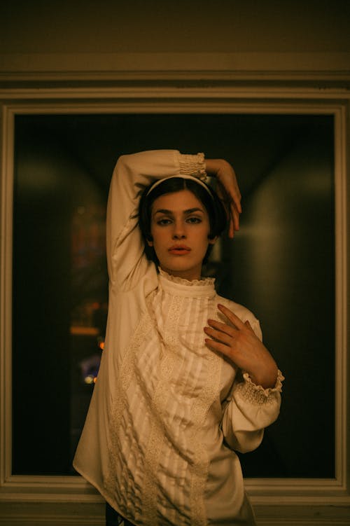 Woman Posing in a Blouse and a Headband