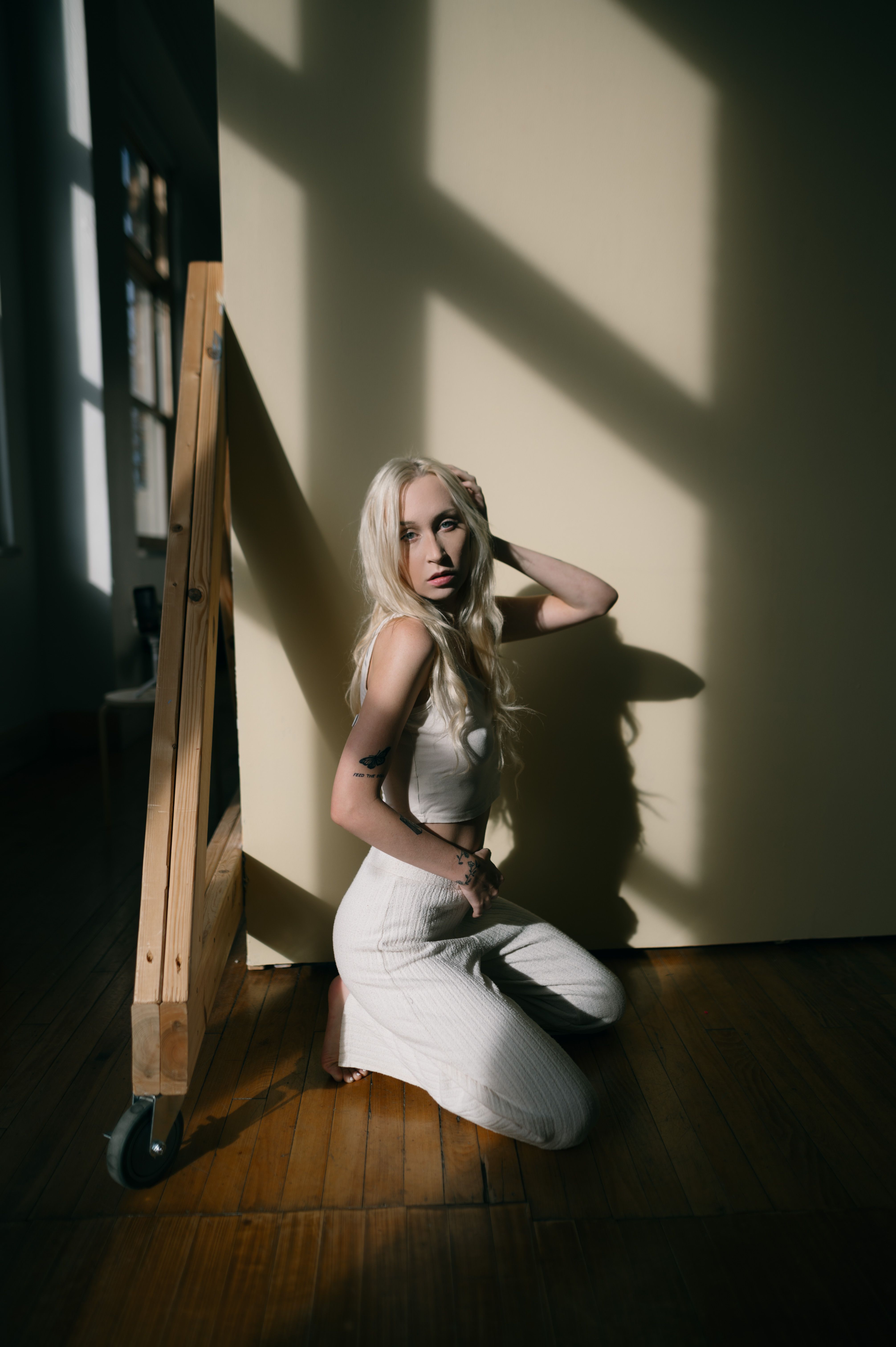 Studio founder portrait in warm window light
