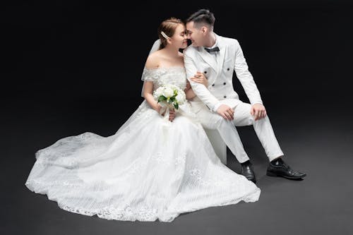 Bride and Groom Sitting Beside Each Other