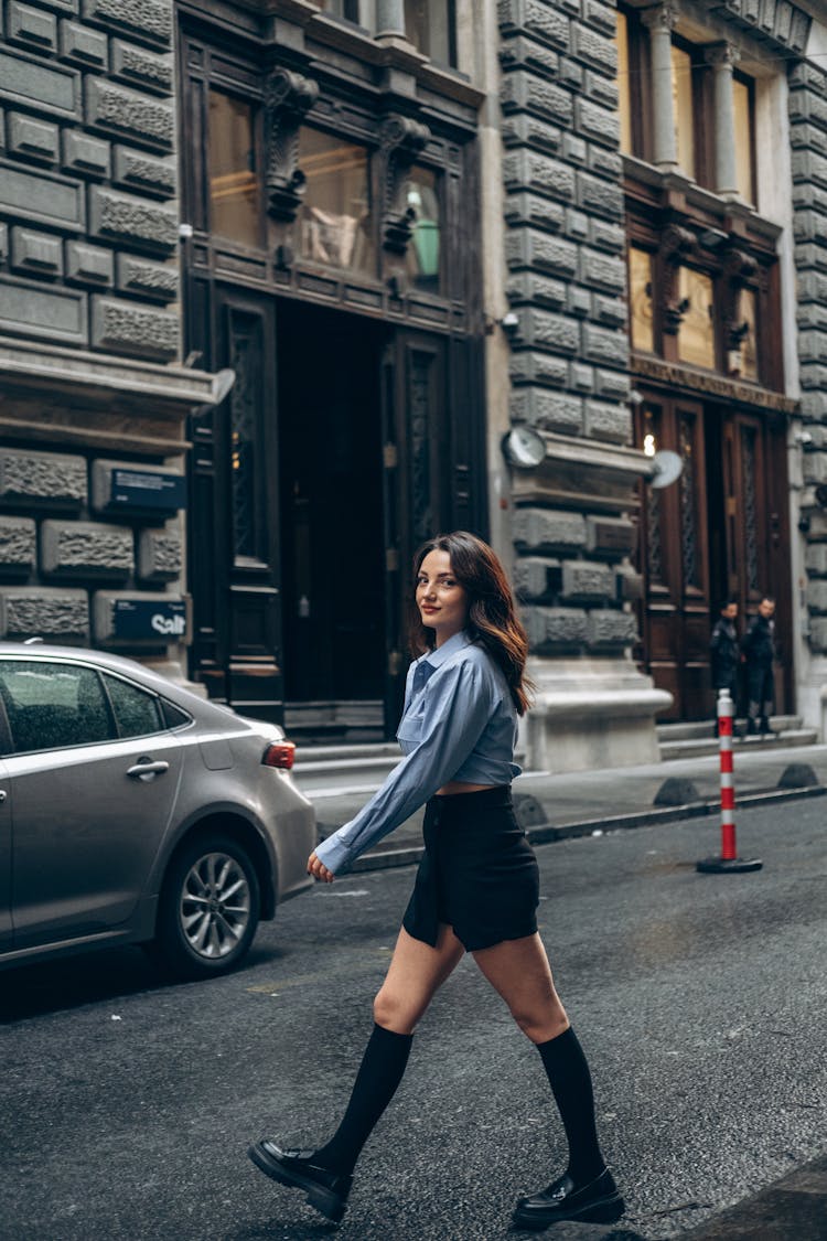 Young Woman Walking On City Street