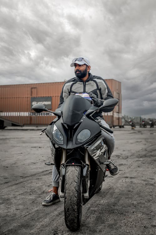 Man Sitting on a Sports Bike