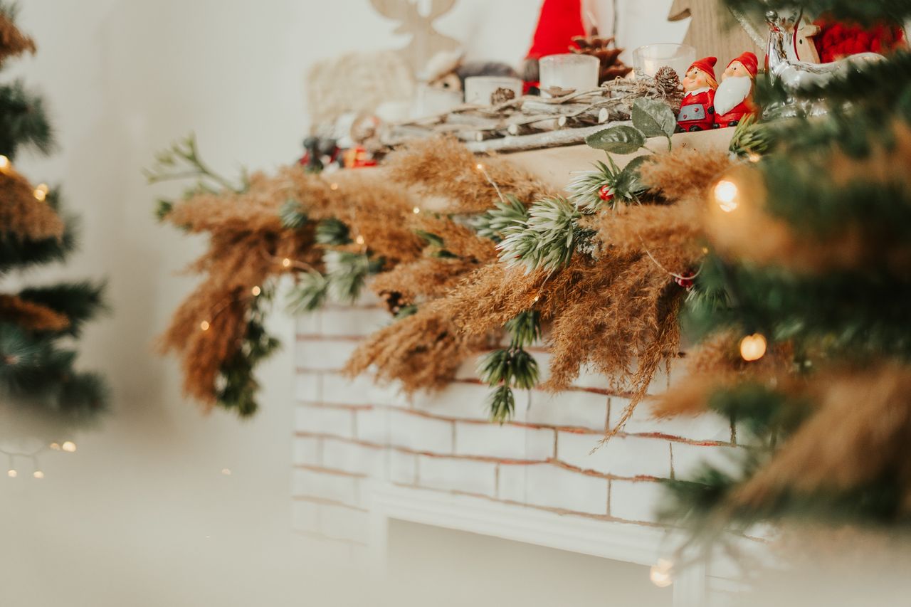 warm and cozy christmas fireplace adorned with natural and festive dec