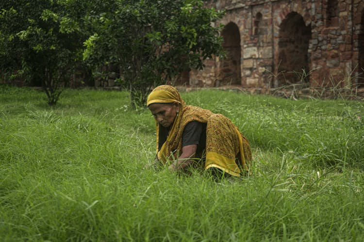 Woman Working On Grass