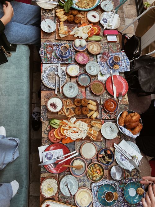 Free A vibrant top view of an assortment of gourmet dishes on a decorative table setting. Stock Photo