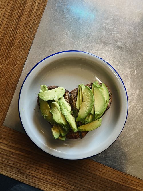 Free A close-up of avocado slices on hearty bread served as a healthy breakfast option. Stock Photo