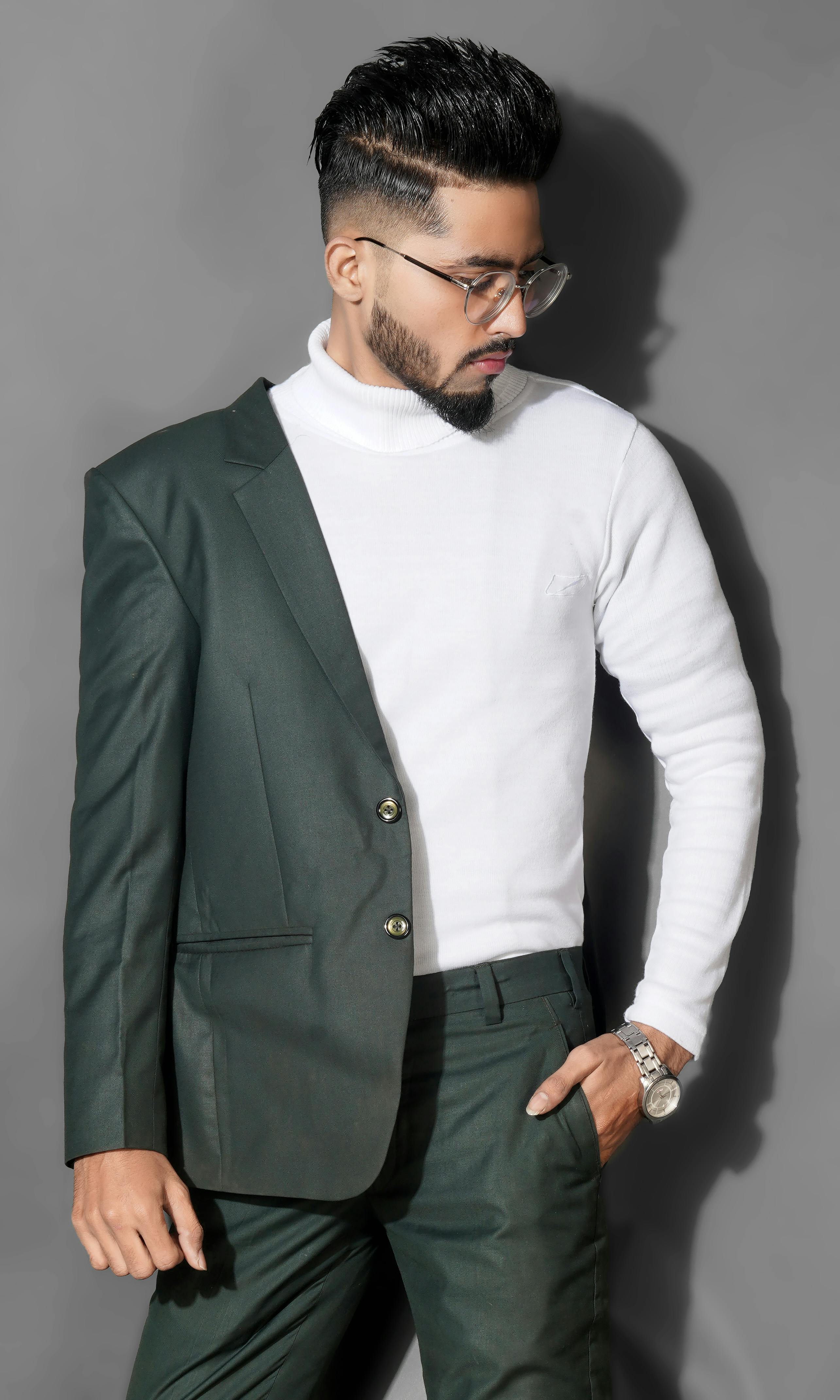 A Man in White Turtleneck Sweater Wearing a Gray Suit and Eyeglasses