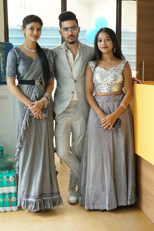 Family Posing Together in Traditional Clothing