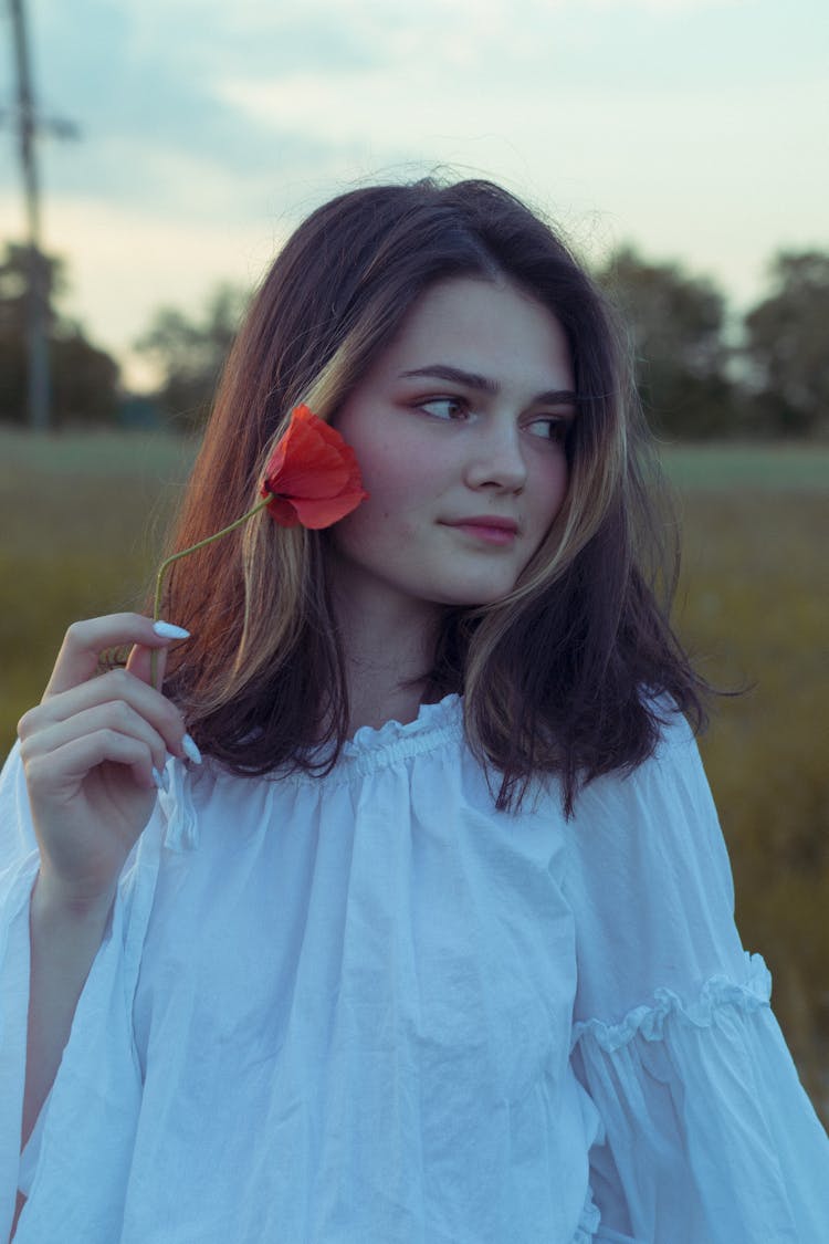 Woman Holding A Flower