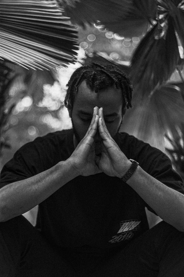 Black And White Portrait Of A Man While Praying