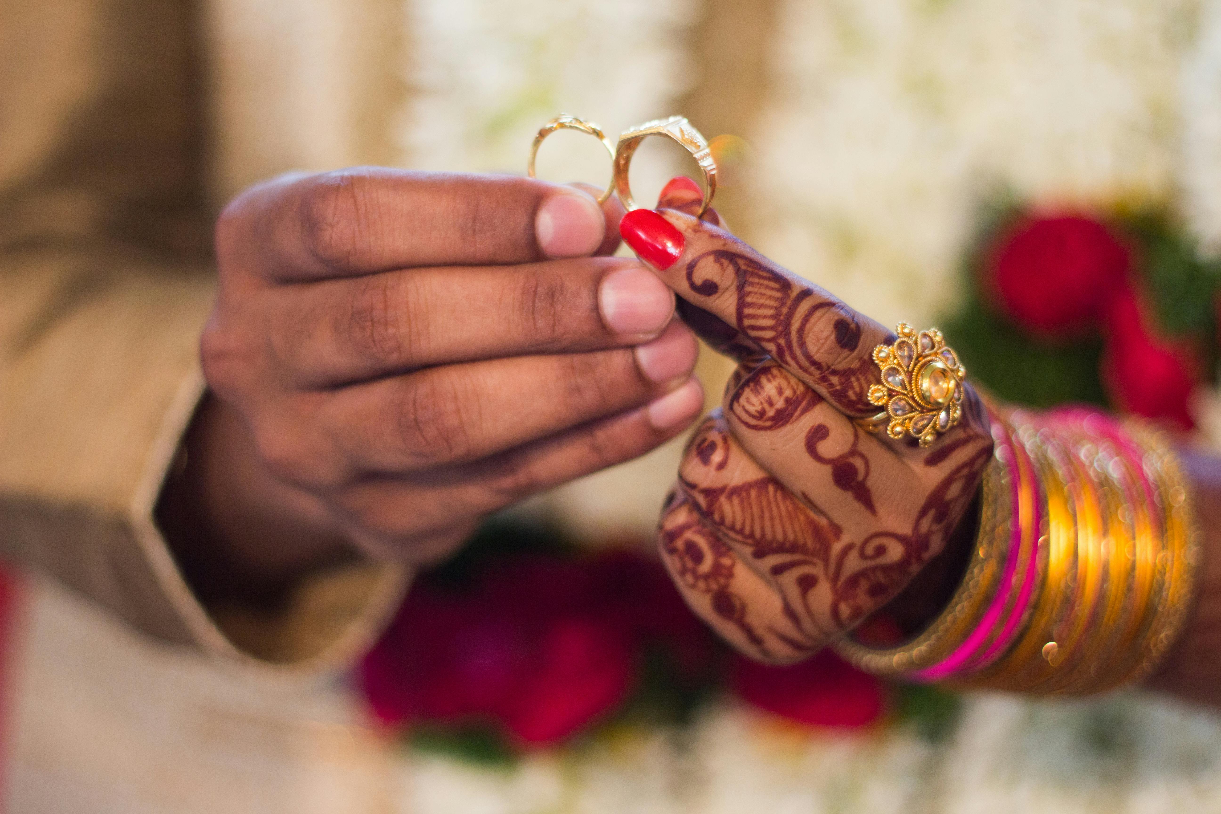 Man and Woman Holding Wedding Rings \u00b7 Free Stock Photo