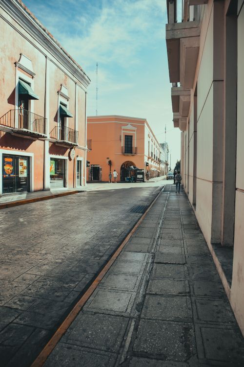 Free Quiet cobblestone street with colonial architecture in a historic town. Stock Photo