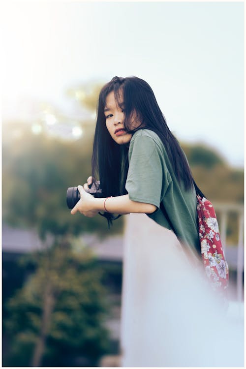 Woman Holding Black Dslr Camera