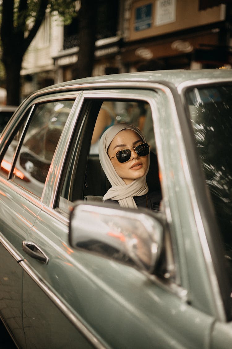 Woman Riding A Car