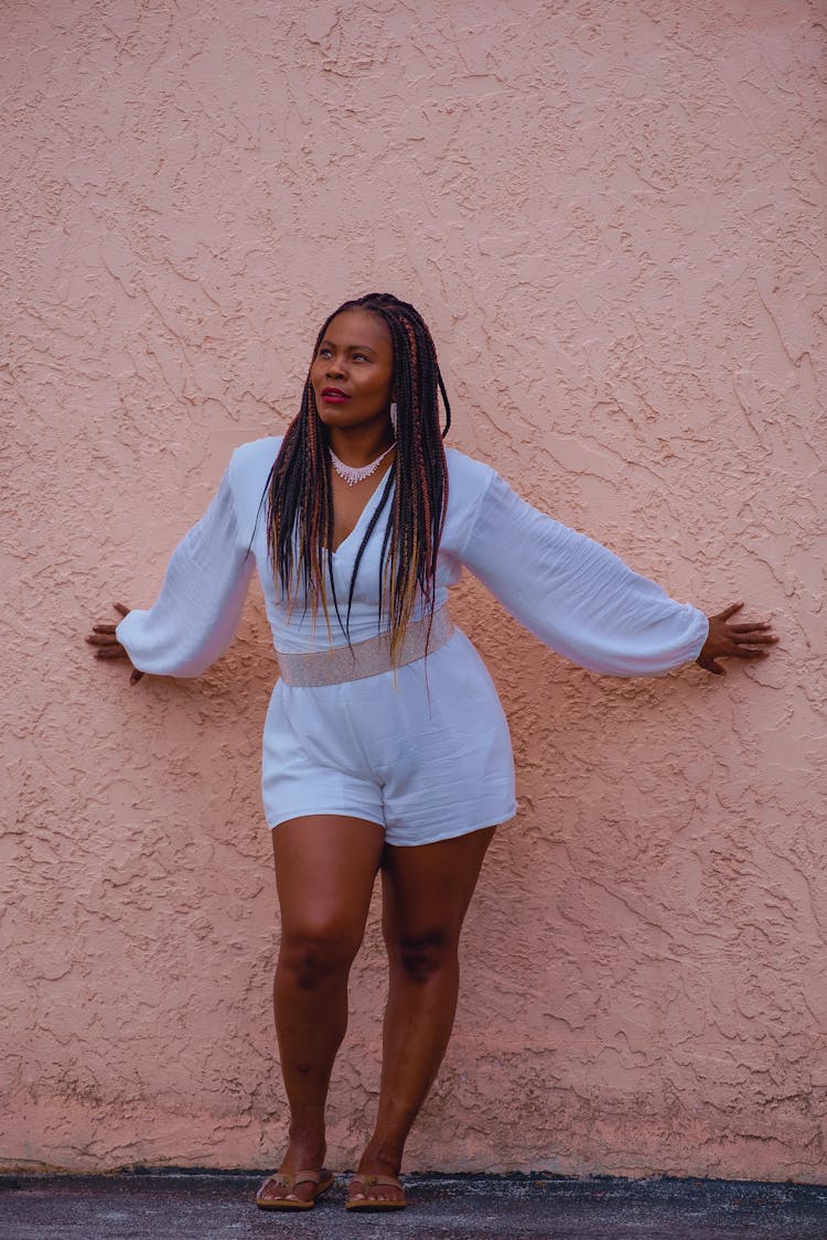 Woman In A White Blouse And Shorts