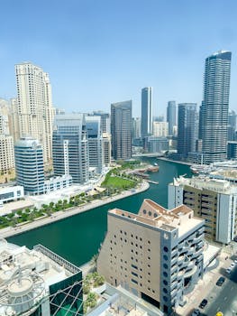 Breathtaking view of Dubai Marina's modern skyline and canal on a clear day.