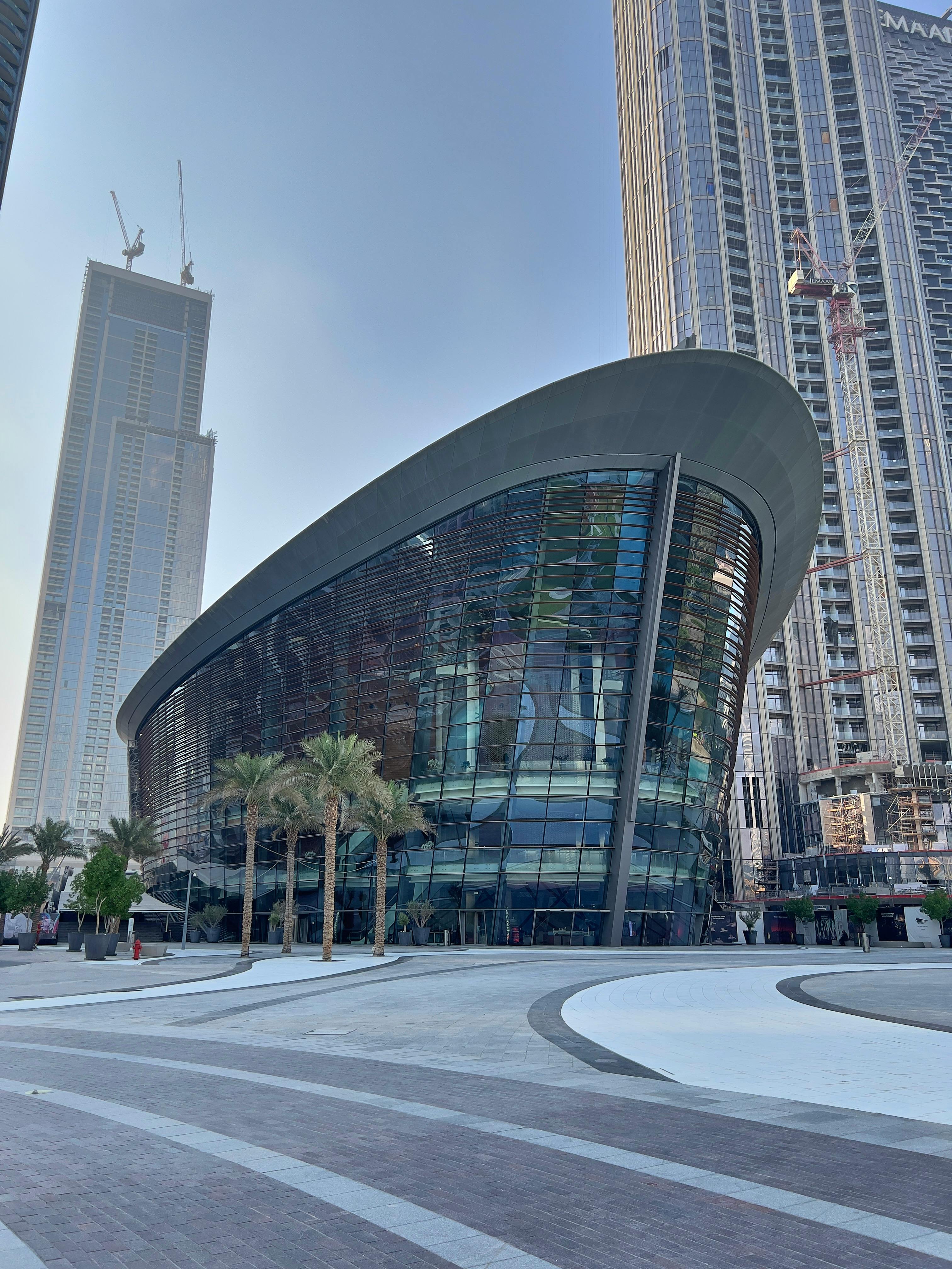 dubai opera house beside high rise buildings