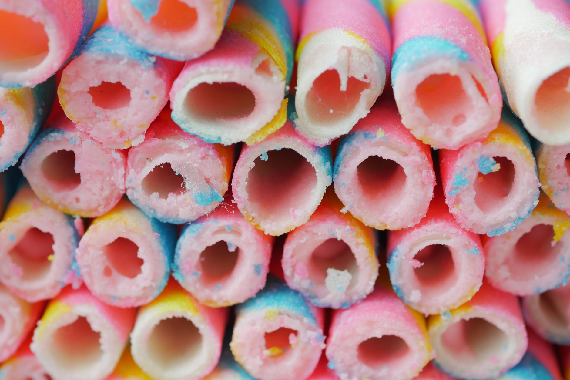 Vibrantly colored wafer sticks in a close-up view, showcasing their delicious texture.