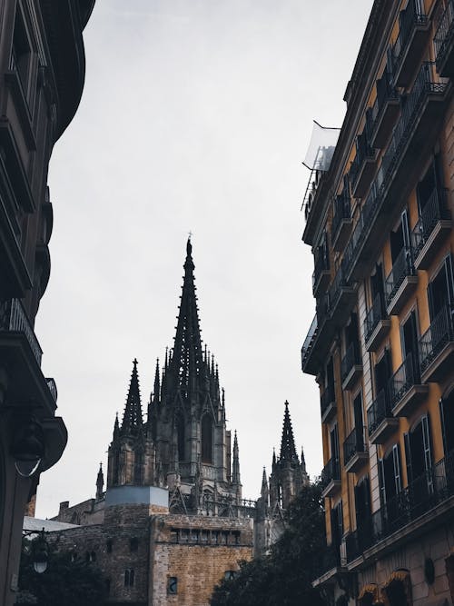 View of the Barcelona Cathedral from an Alley between Buildings