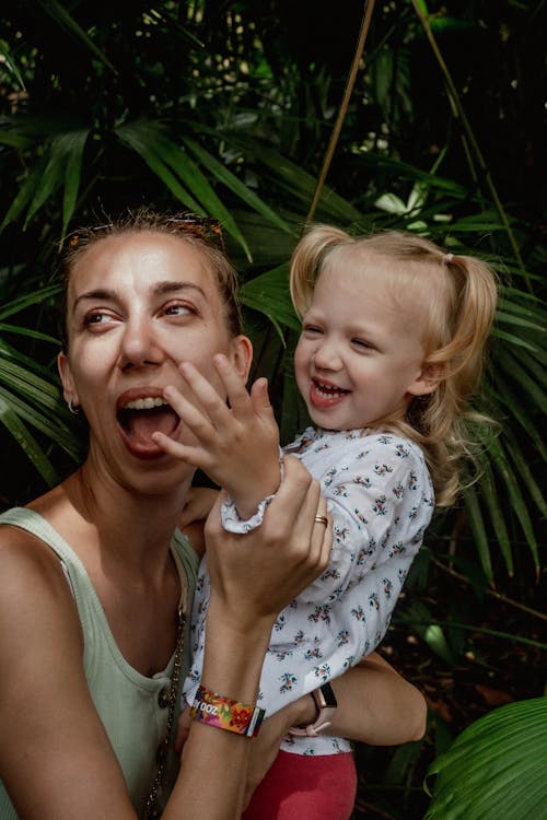 Free A Woman Holding Her Daughter  Stock Photo