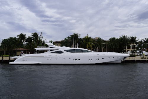 White Yacht Docked at a Harbor