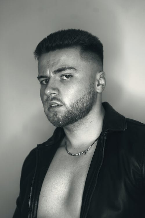 Black and White Portrait of a Young Man with an Unbuttoned Shirt 