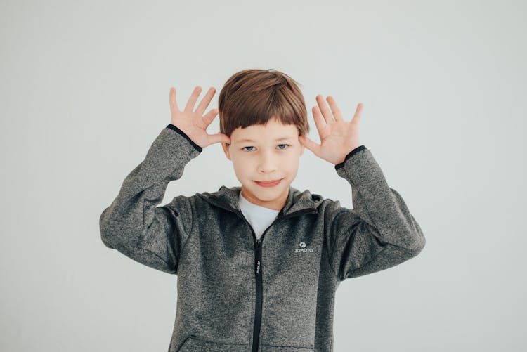 Boy Wearing Gray Zip Up Jacket