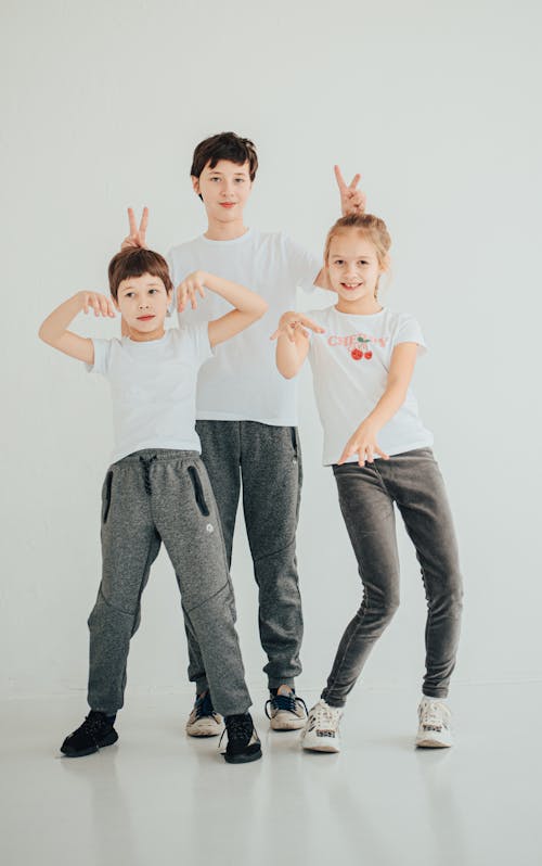 A Group of Kids in White Shirt and Gray Pants
