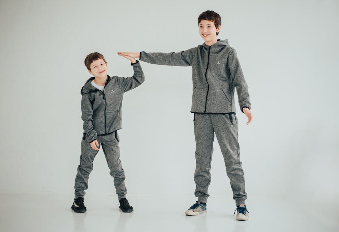 Brothers Wearing Gray Twinning Outfit while Posing at the Camera · Free