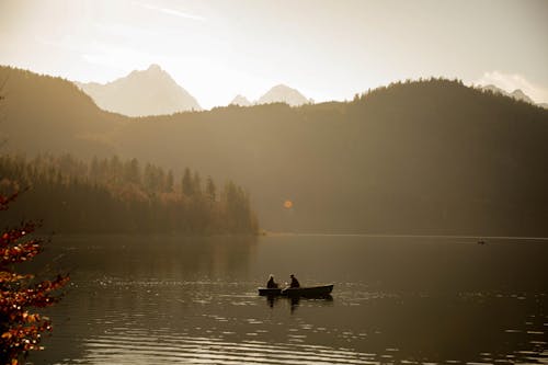 Couple on a Lake in the Mountains at Sunset