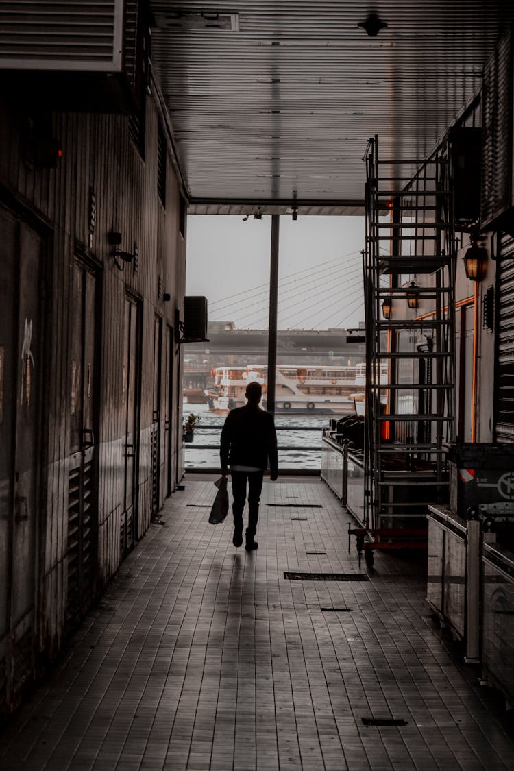 Silhouette Of A Man On A Corridor