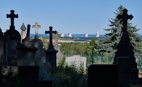Free Strange view of a nuclear power plant from a cemetery Stock Photo