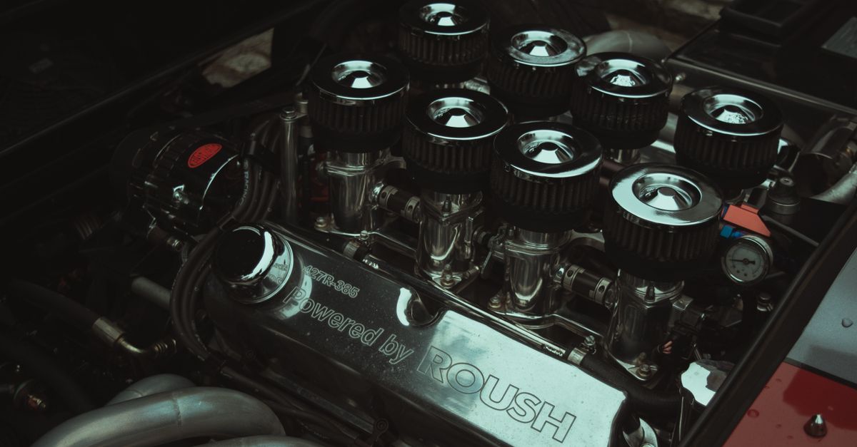 High-performance car engine with air filters and chrome detailing showcasing automotive engineering.
