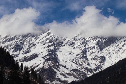 Free Stunning view of snow-capped mountains under a cloudy sky in Manali, Himachal Pradesh, India. Stock Photo