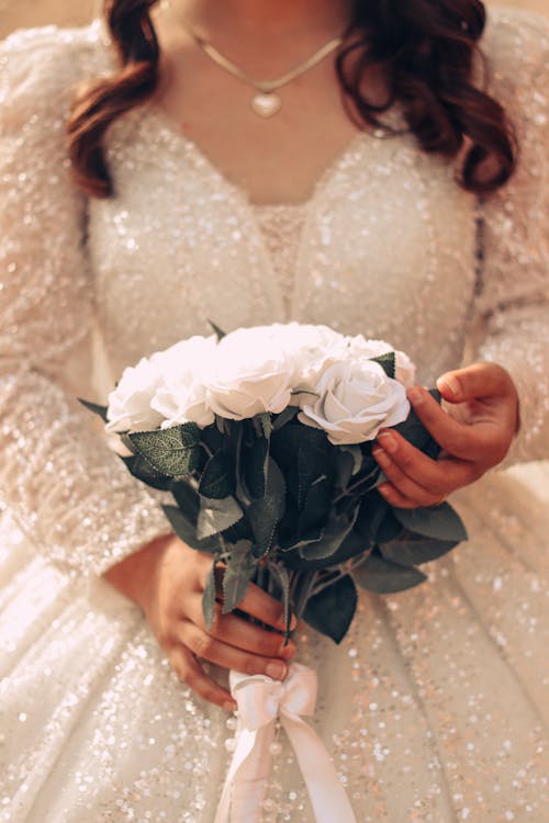 Bride Holding a Bouquet of White Flowers