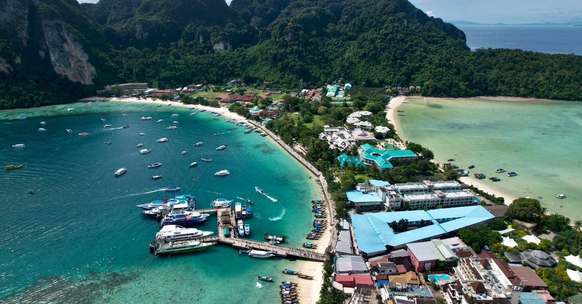 Aerial view of a tropical island archipelago with turquoise water and lush hills