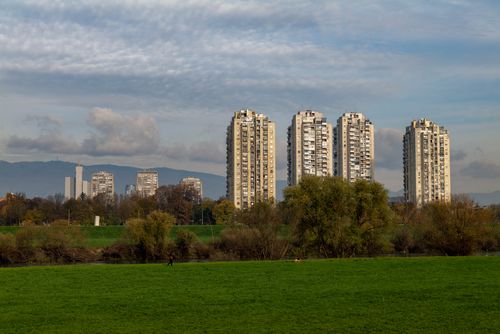 Free Panoramic view of modern skyscrapers in Zagreb surrounded by lush greenery under a clear sky. Stock Photo
