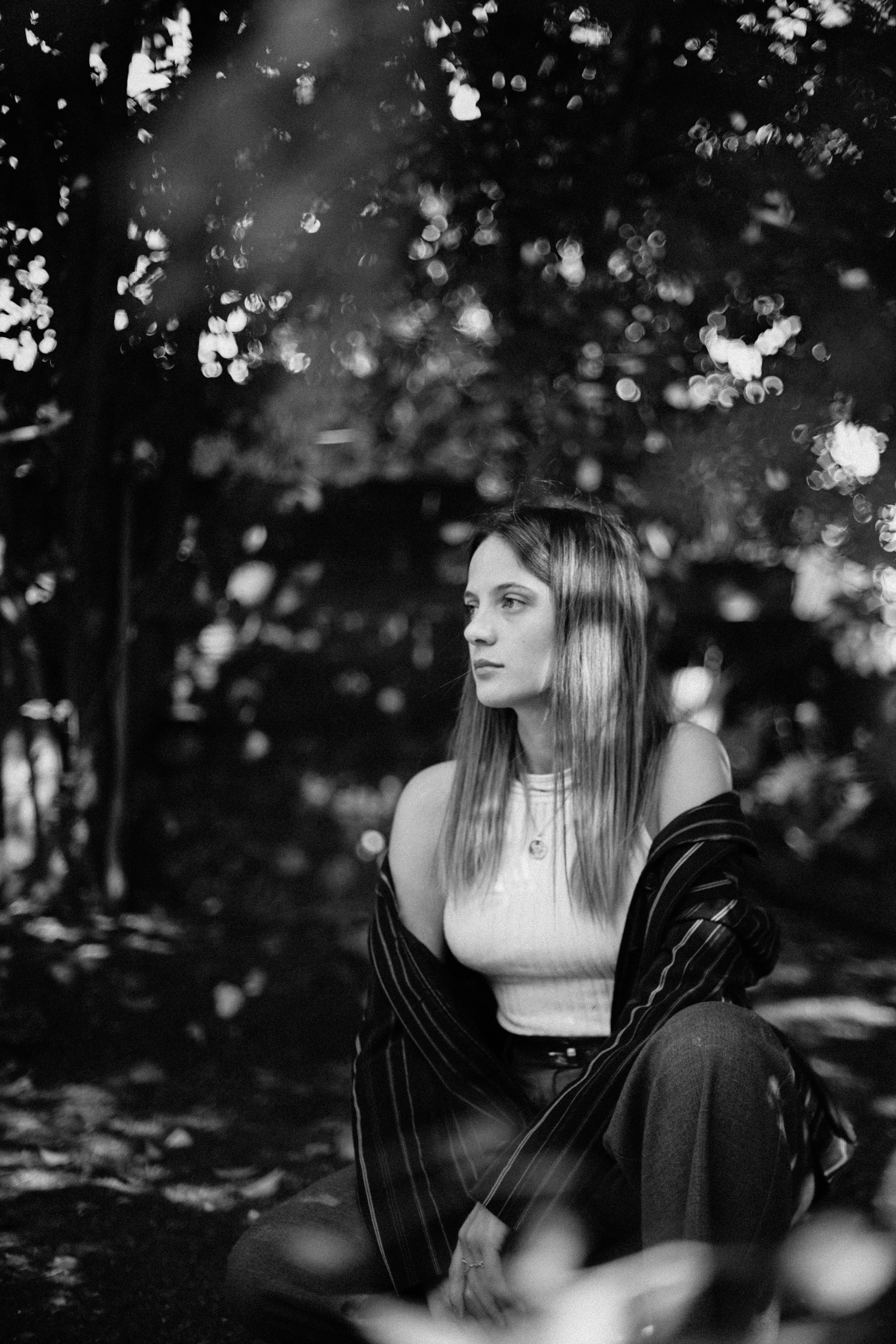 Woman Posing under Tree in Black and White · Free Stock Photo