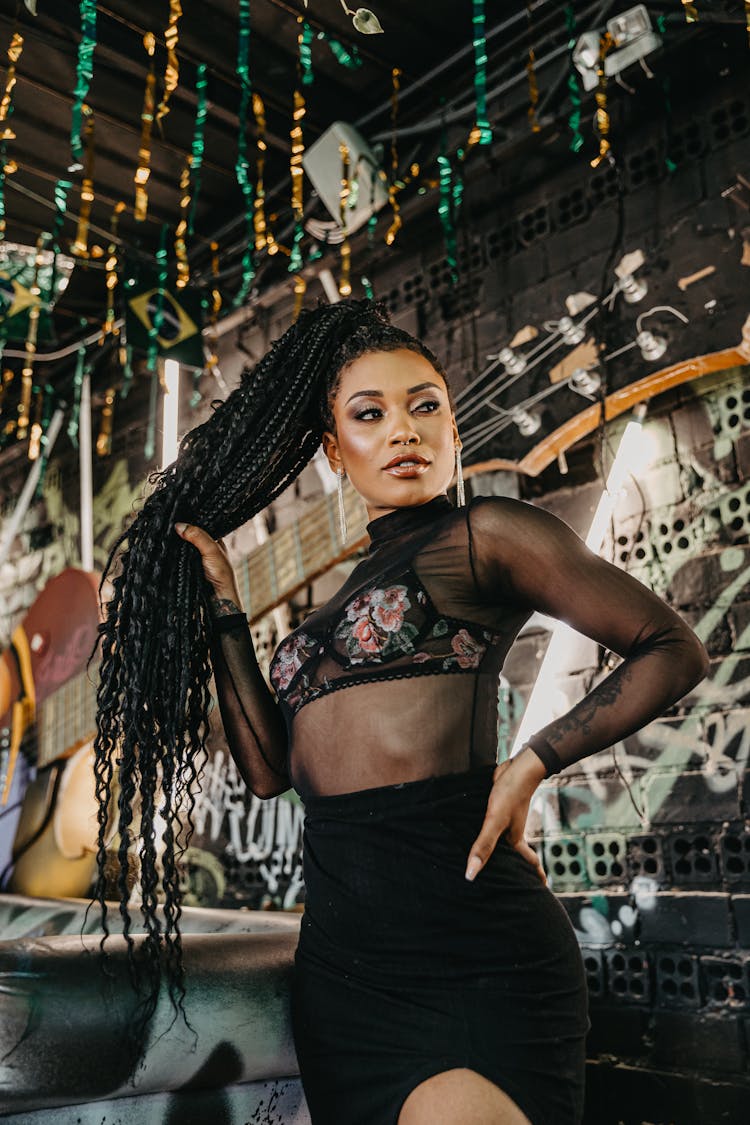 Beautiful Woman With Braids In Bar