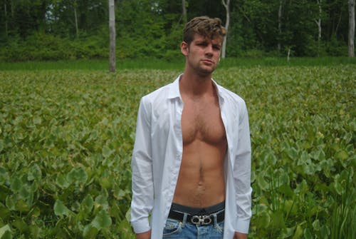 Young Man in an Unbuttoned White Shirt 