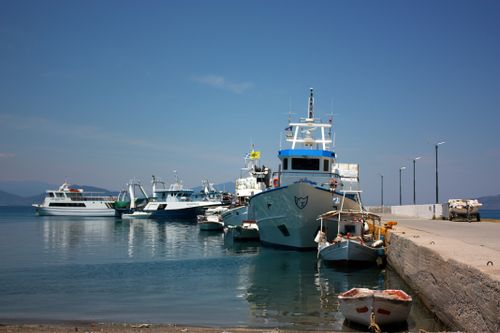 Free A serene harbor view featuring boats docked at the pier on a sunny day. Stock Photo